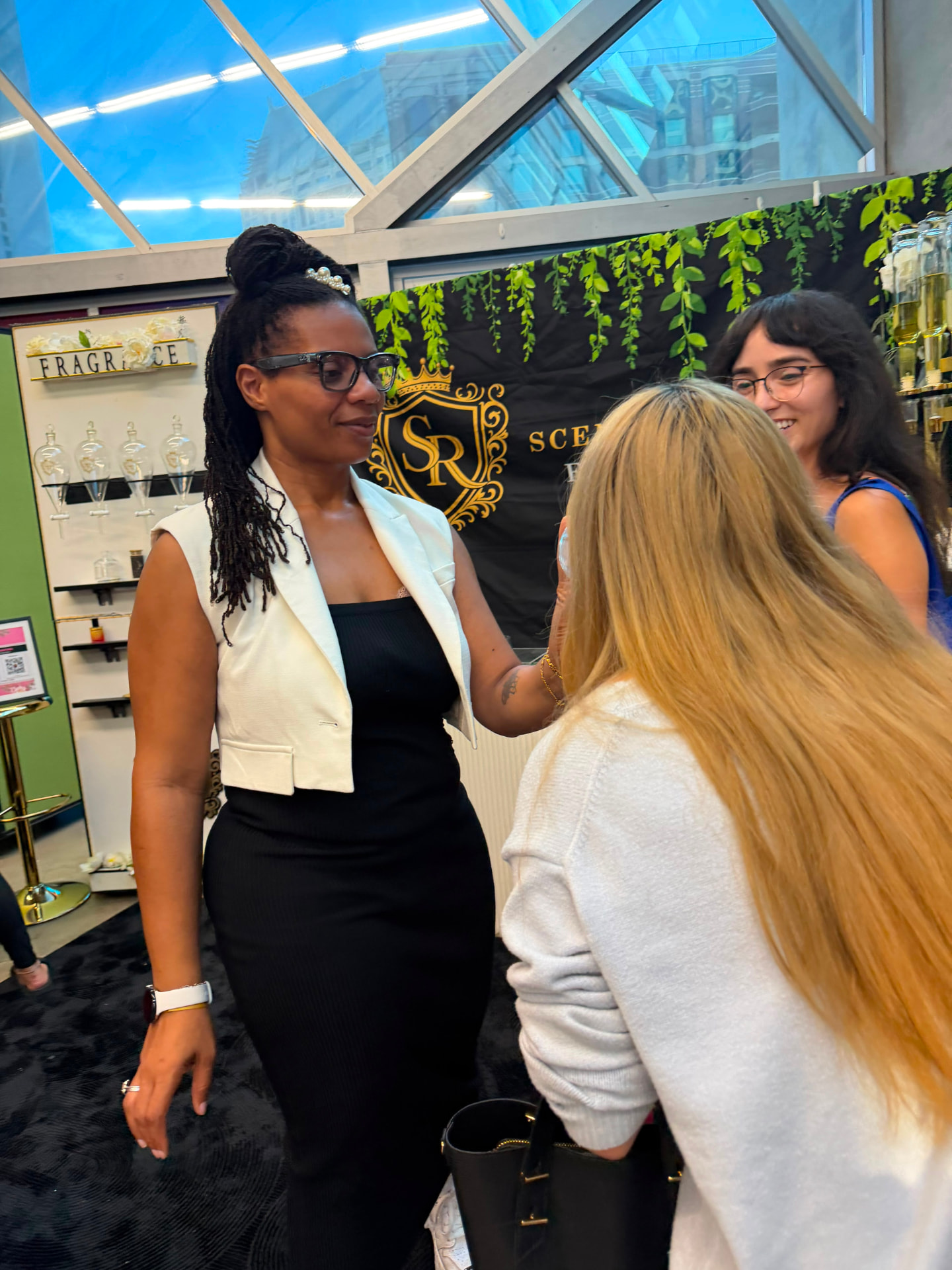 The Scentual Reserve founder in conversation with guests at the fragrance counter