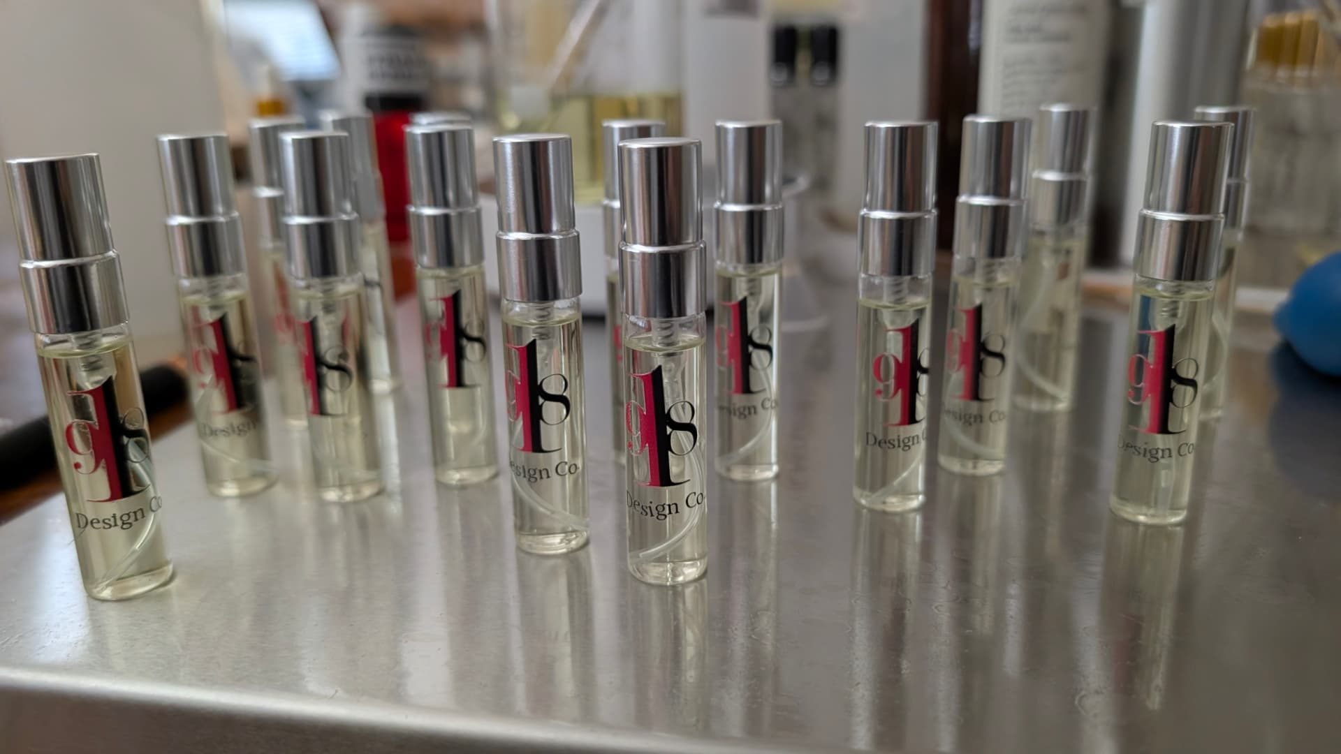 Miniature signature fragrance bottles branded for 918 Design Co.