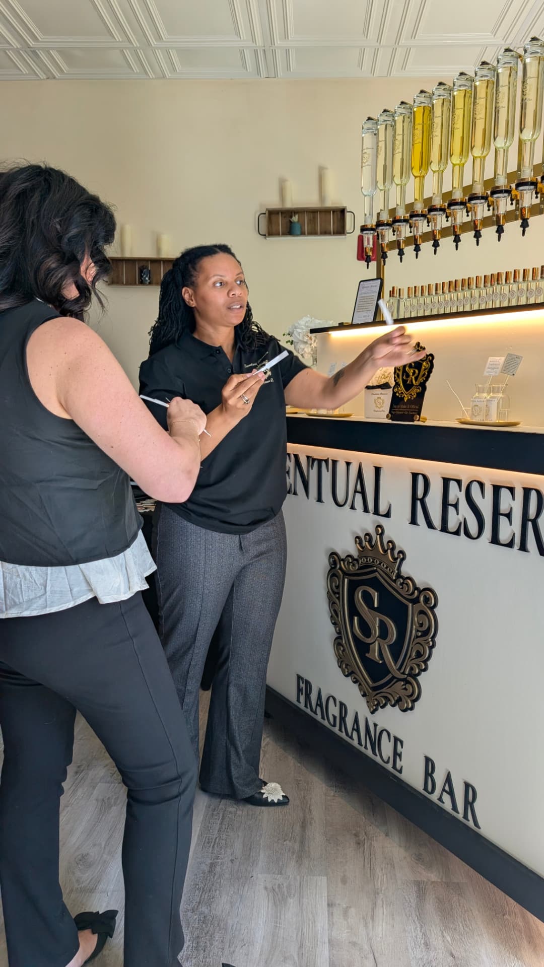 A Scentual Reserve curator guiding a guest through fragrance selection