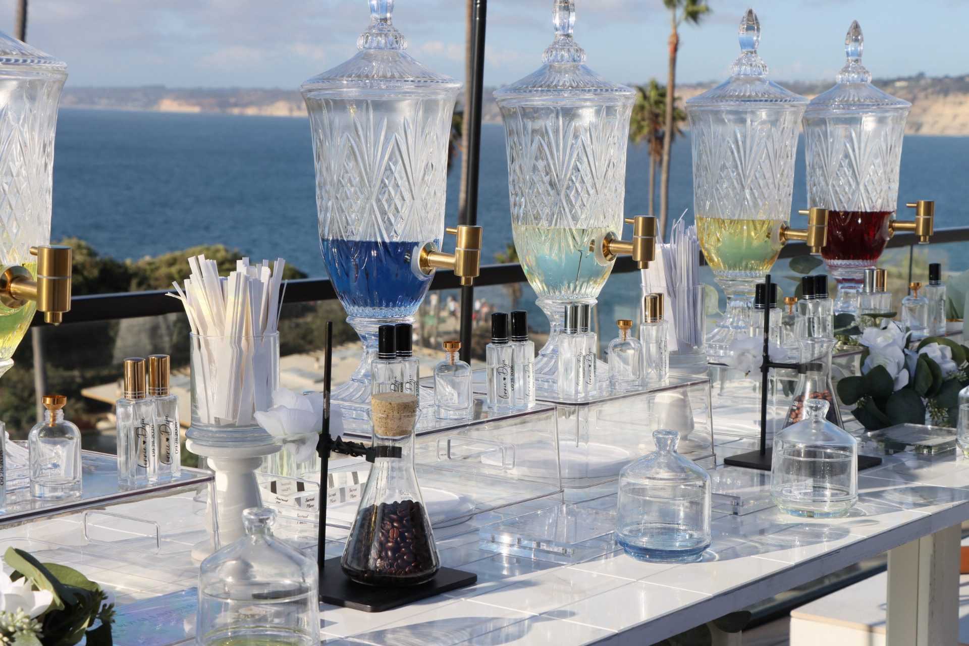 Crystal dispensers filled with fragrance overlooking the coastline