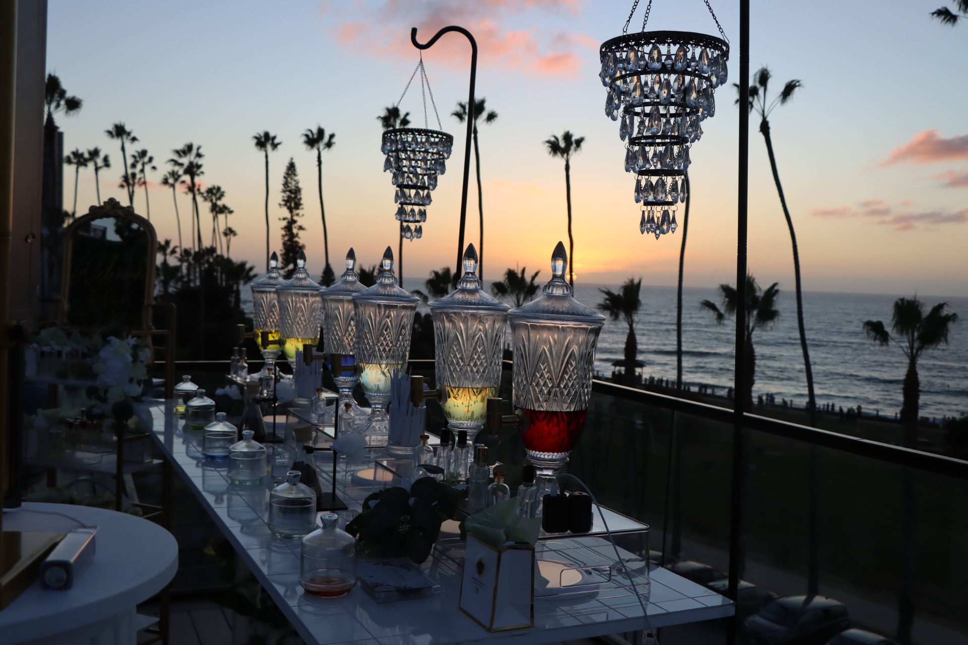 Crystal fragrance dispensers and chandeliers at sunset over the ocean