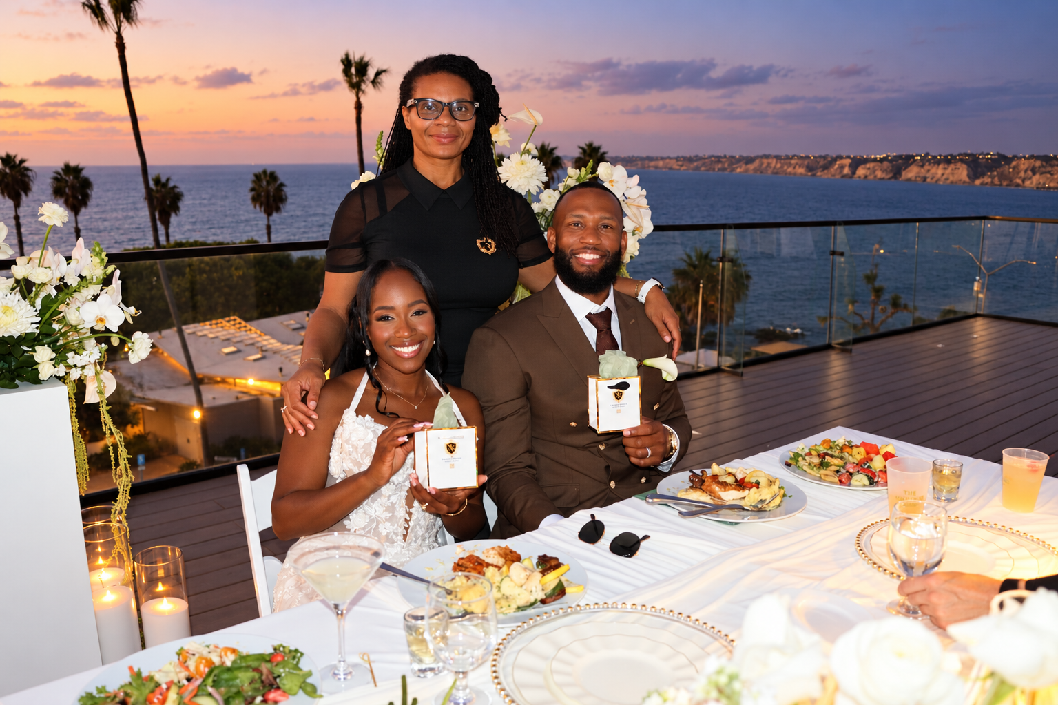 Scentual Reserve founder with the bride and groom holding fragrance keepsakes at their oceanfront reception