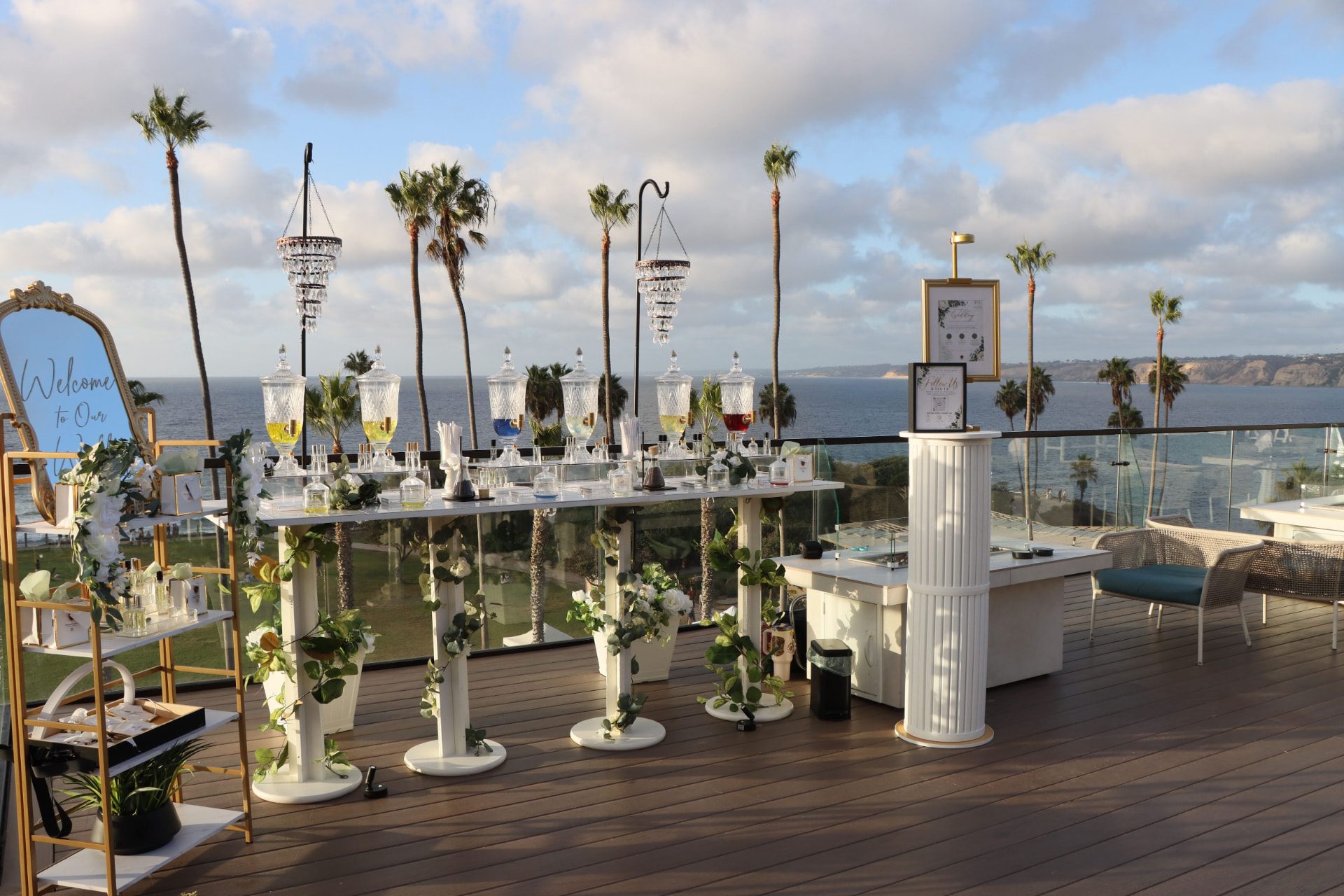 Scentual Reserve fragrance bar with crystal dispensers on an oceanfront terrace
